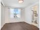 Light and airy bedroom with hardwood floors and a view at 3278 Woodland Brook Way, Wesley Chapel, FL 33543