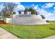 Community entrance with a large, cascading water feature and the Winding Ridge sign at 3278 Woodland Brook Way, Wesley Chapel, FL 33543