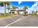 Gated community entrance with palm trees and landscaping at 3278 Woodland Brook Way, Wesley Chapel, FL 33543