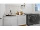 Laundry room with washer, dryer, and ample counter space at 3278 Woodland Brook Way, Wesley Chapel, FL 33543