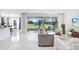 Open concept living space with sliding glass doors leading to backyard at 3278 Woodland Brook Way, Wesley Chapel, FL 33543