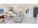 Open living room with gray sofa and modern decor at 3278 Woodland Brook Way, Wesley Chapel, FL 33543