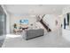 Light-filled living area with comfortable seating and sliding doors at 3278 Woodland Brook Way, Wesley Chapel, FL 33543