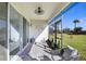 Spacious screened porch with view of the backyard at 3278 Woodland Brook Way, Wesley Chapel, FL 33543