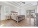 Main bedroom with king-size bed, sliding glass doors, and light wood furniture at 3326 W Heiter St, Tampa, FL 33607