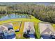 Bird's-eye view of home with pond and surrounding area at 35980 Morse Willow Ct, Zephyrhills, FL 33541