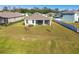 House with a covered patio and spacious backyard at 35980 Morse Willow Ct, Zephyrhills, FL 33541