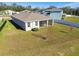 Property view showcasing house and backyard at 35980 Morse Willow Ct, Zephyrhills, FL 33541