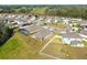 Community overview showing homes and a central pond at 35980 Morse Willow Ct, Zephyrhills, FL 33541