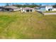 Spacious backyard with pond and neighboring homes at 35980 Morse Willow Ct, Zephyrhills, FL 33541