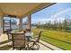 Covered patio overlooking a tranquil pond at 35980 Morse Willow Ct, Zephyrhills, FL 33541