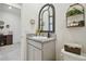 Small bathroom with granite countertop and decorative mirror at 35980 Morse Willow Ct, Zephyrhills, FL 33541