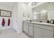Double vanity bathroom with granite countertop and shower at 35980 Morse Willow Ct, Zephyrhills, FL 33541