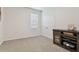 Bright bedroom with double doors and carpet flooring at 35980 Morse Willow Ct, Zephyrhills, FL 33541