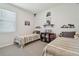 Twin bedroom with rustic decor and plenty of storage at 35980 Morse Willow Ct, Zephyrhills, FL 33541