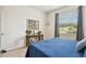 Bedroom with blue comforter and decorative wall art at 35980 Morse Willow Ct, Zephyrhills, FL 33541