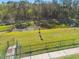 Community dog park with pond and fenced-in area at 35980 Morse Willow Ct, Zephyrhills, FL 33541
