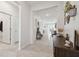 Bright and airy entryway with tile flooring, access to other rooms, and decor at 35980 Morse Willow Ct, Zephyrhills, FL 33541