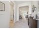 Bright and spacious entryway with tile flooring and views into the living area at 35980 Morse Willow Ct, Zephyrhills, FL 33541