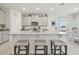 Modern kitchen with granite countertops and stainless steel appliances at 35980 Morse Willow Ct, Zephyrhills, FL 33541