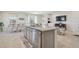 Kitchen island with granite countertop and stainless steel dishwasher at 35980 Morse Willow Ct, Zephyrhills, FL 33541