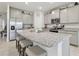 Modern kitchen with granite countertops and stainless steel appliances at 35980 Morse Willow Ct, Zephyrhills, FL 33541