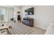 Living room featuring a cozy fireplace and ample seating at 35980 Morse Willow Ct, Zephyrhills, FL 33541