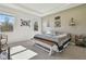 Spacious main bedroom with large windows and a comfortable bed at 35980 Morse Willow Ct, Zephyrhills, FL 33541