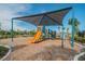 Playground with shade structure and play equipment at 35980 Morse Willow Ct, Zephyrhills, FL 33541