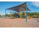 Playground with shade structure and play equipment at 35980 Morse Willow Ct, Zephyrhills, FL 33541