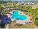 Community pool with surrounding landscaping at 35980 Morse Willow Ct, Zephyrhills, FL 33541