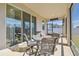 Enjoy the outdoors in this screened porch, featuring a table and chairs at 35980 Morse Willow Ct, Zephyrhills, FL 33541