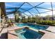 Relaxing pool and spa area with a screened enclosure at 3815 Gaviota Dr, Sun City Center, FL 33573