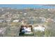 Aerial view of home near the water with pool and lush landscaping at 4000 40Th S St, St Petersburg, FL 33711