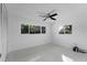 Simple bedroom with carpet flooring and ceiling fan at 4000 40Th S St, St Petersburg, FL 33711