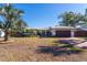 Updated mid-century modern home with landscaped yard and brick driveway at 4000 40Th S St, St Petersburg, FL 33711