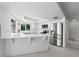 Modern white kitchen with stainless steel appliances at 4000 40Th S St, St Petersburg, FL 33711