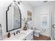 Bathroom with a black frame mirror and marble vanity top at 4687 Alisa Ne Cir, St Petersburg, FL 33703