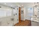 Spa-like bathroom with large shower, marble vanity, and hardwood floors at 4687 Alisa Ne Cir, St Petersburg, FL 33703