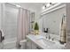 Bathroom with a bathtub, shower, and marble vanity top at 4687 Alisa Ne Cir, St Petersburg, FL 33703