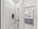 Clean bathroom features a walk-in shower with marble tile and a separate tub at 4687 Alisa Ne Cir, St Petersburg, FL 33703