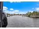 Serene canal view with neighboring waterfront homes and lush vegetation at 4687 Alisa Ne Cir, St Petersburg, FL 33703
