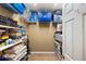Large storage closet with shelving for various items, including games and linens at 4687 Alisa Ne Cir, St Petersburg, FL 33703