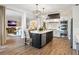 Modern kitchen with island, stainless steel appliances, and hardwood floors at 4687 Alisa Ne Cir, St Petersburg, FL 33703