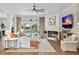 Spacious living room with fireplace, large TV, and comfy seating at 4687 Alisa Ne Cir, St Petersburg, FL 33703