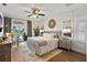 Main bedroom with king-size bed, water view and calm decor at 4687 Alisa Ne Cir, St Petersburg, FL 33703