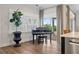 Room with a grand piano, large window, and access to the backyard at 4687 Alisa Ne Cir, St Petersburg, FL 33703