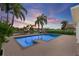 Spacious pool and patio area with tranquil sunset views at 4687 Alisa Ne Cir, St Petersburg, FL 33703