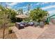 Relaxing backyard patio with wicker furniture, umbrella, and brick pavers at 5107 27Th S Ave, Gulfport, FL 33707