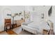 Charming bedroom with a double bed, hardwood floors, and a tranquil atmosphere at 5107 27Th S Ave, Gulfport, FL 33707